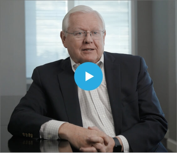 John Sitting at Desk During Interview